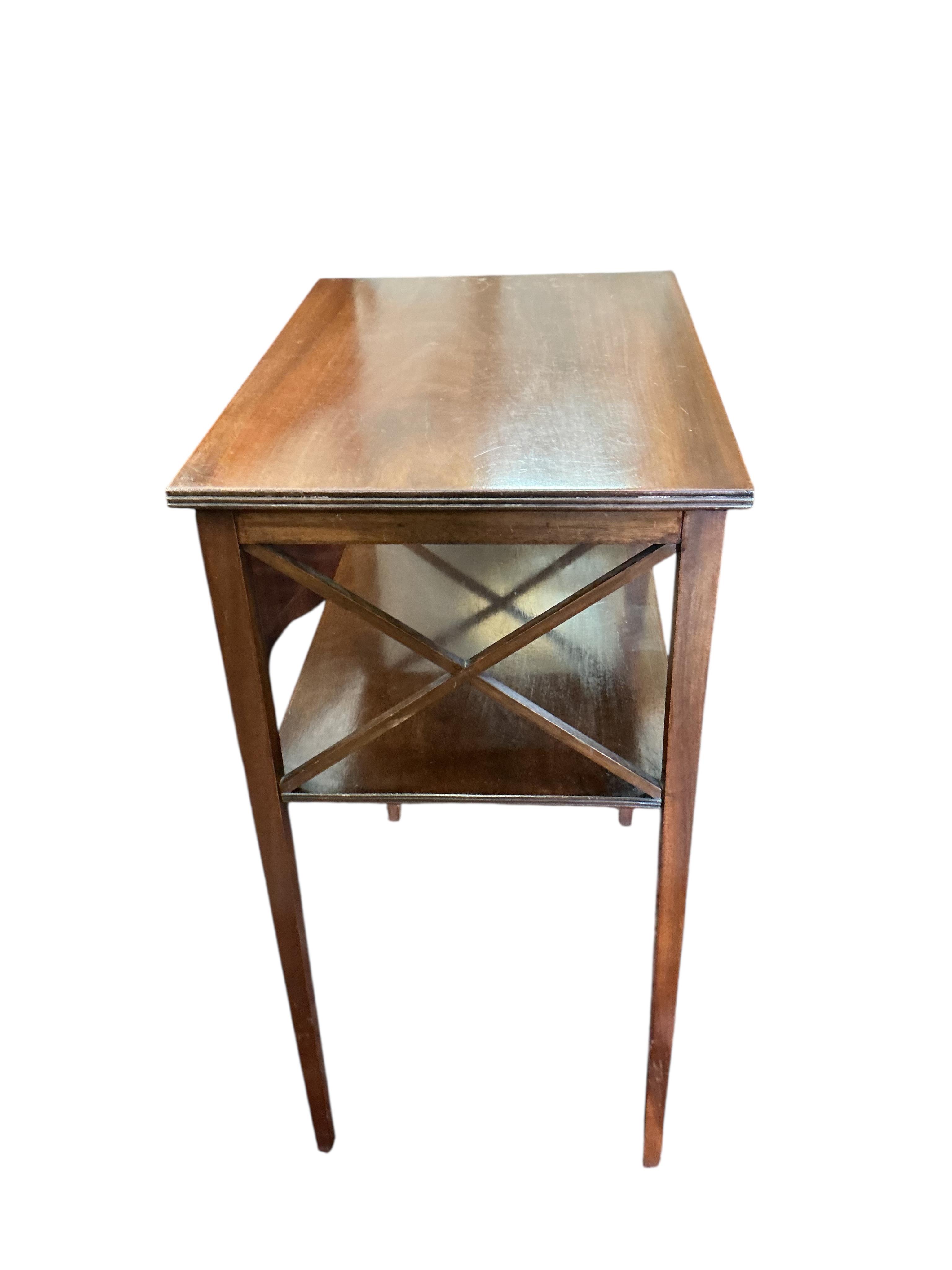 A pair of Edwardian rectangular mahogany two tier occasional tables, width 49cm, depth 35cm, height 69cm